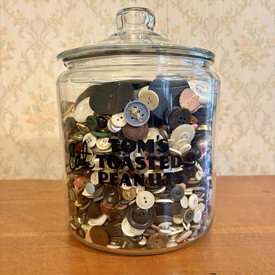 A Collection of Vintage Sewing Buttons and Notions in a Tom's Toasted Peanuts Glass Jar. This 