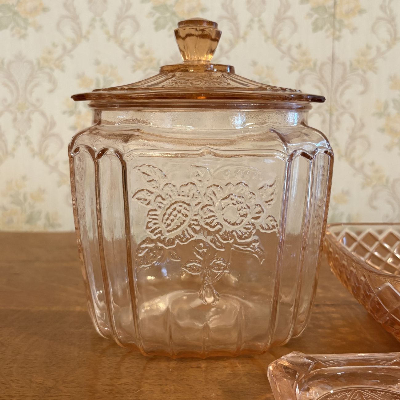 Three Pieces of Pink Depression Glass Including a Sunflower Pattern Cookie Jar