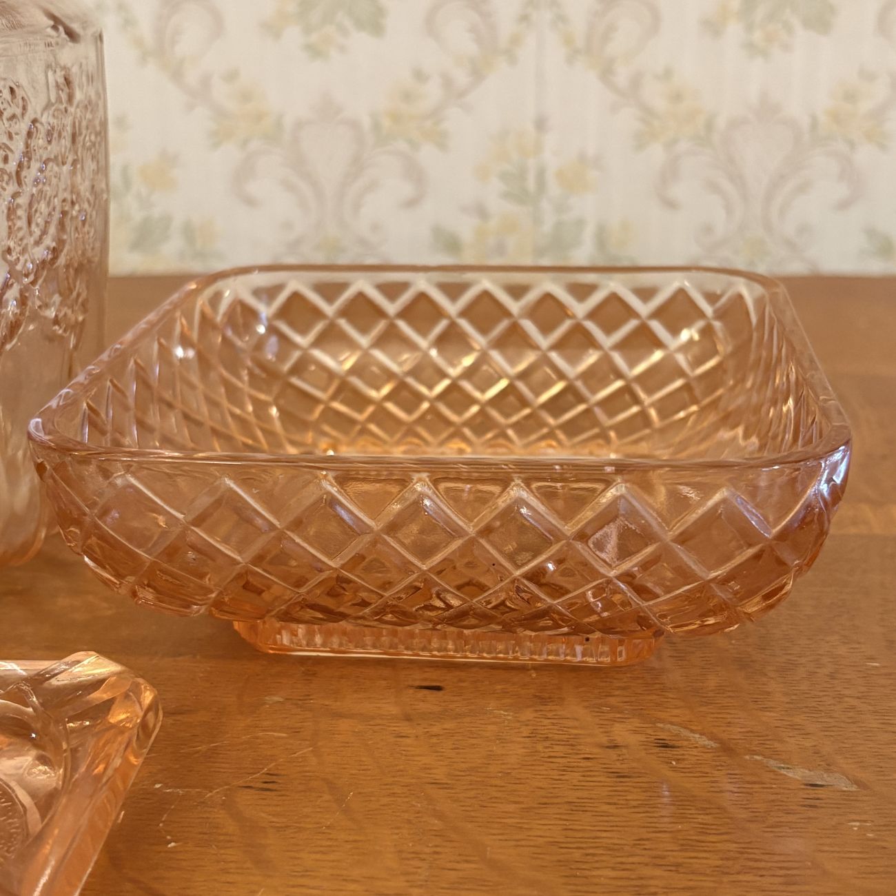 Three Pieces of Pink Depression Glass Including a Sunflower Pattern Cookie Jar