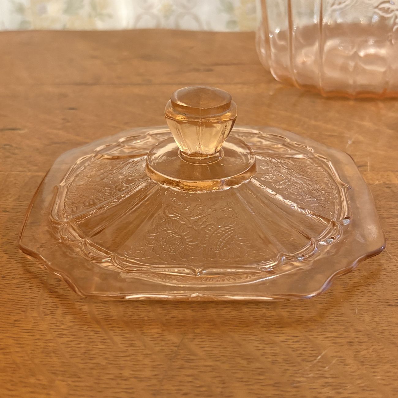 Three Pieces of Pink Depression Glass Including a Sunflower Pattern Cookie Jar