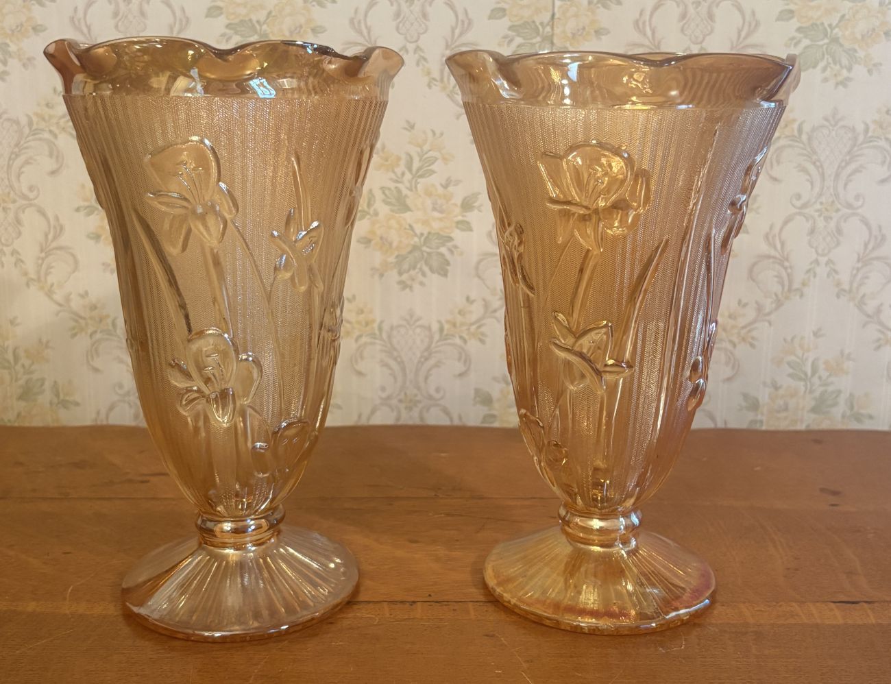 A Pair of Marigold Carnival Glass Footed Vases in Iris and Herringbone Pattern