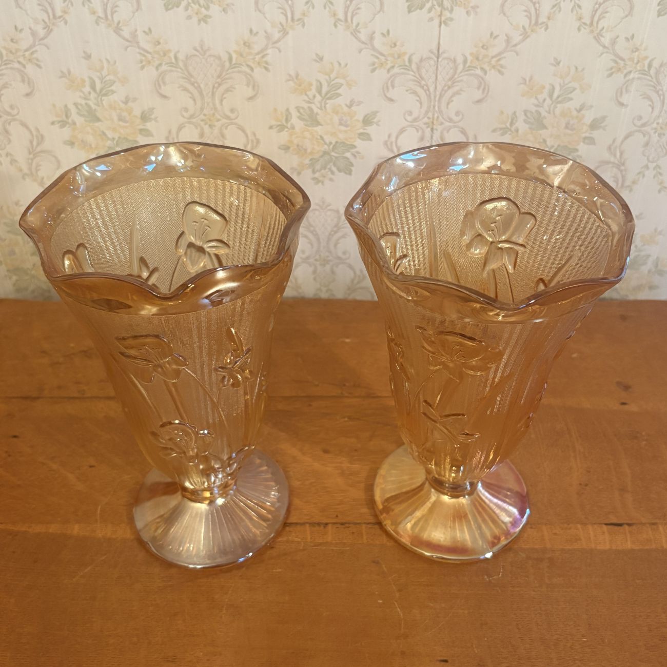 A Pair of Marigold Carnival Glass Footed Vases in Iris and Herringbone Pattern