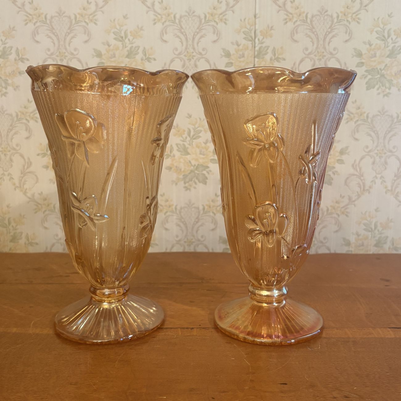 A Pair of Marigold Carnival Glass Footed Vases in Iris and Herringbone Pattern