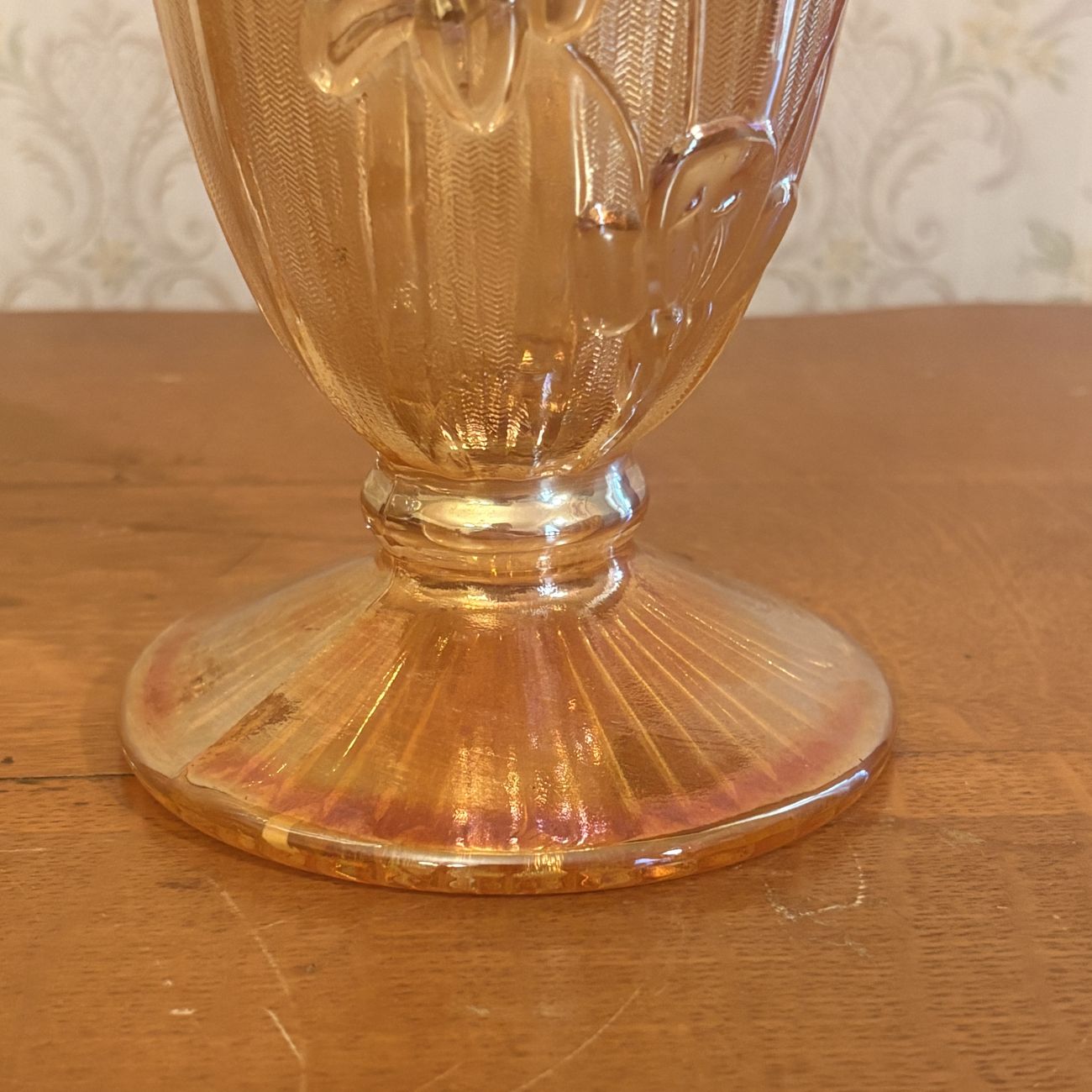 A Pair of Marigold Carnival Glass Footed Vases in Iris and Herringbone Pattern