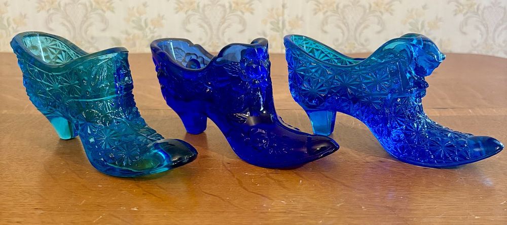Lot 259: Three Blue Pressed Glass Decorative Shoes Including Fenton Rose Pattern