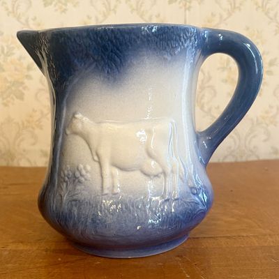 Lincoln Day Signed Blue and White Stoneware Cow Pitcher Dated 1982. A ceramic pitcher 