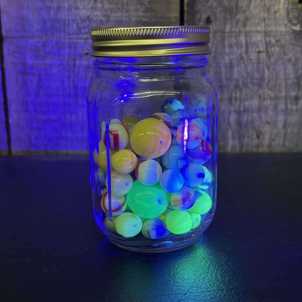 Lot 313: A Collection of Vintage Glass Marbles in a Glass Storage Jar