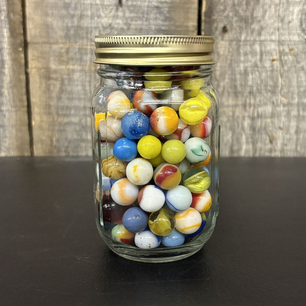 Lot 314: A Collection of Vintage Glass Marbles in a Glass Mason Jar