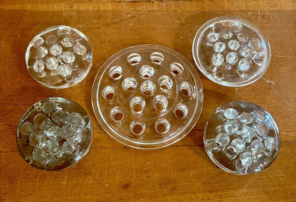Lot 317: A Collection of Five Vintage Clear Pressed Glass Flower Frogs