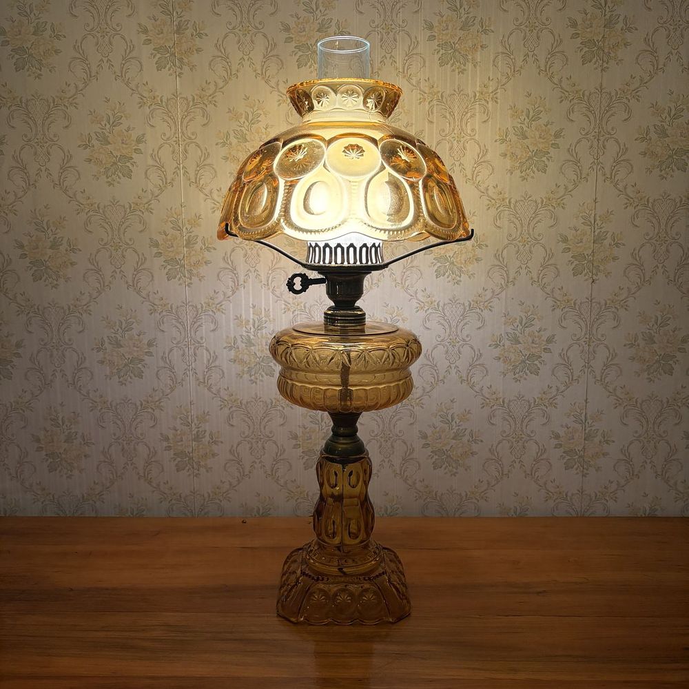 Lot 319: Amber Pressed Glass Moon and Stars Pattern Table Lamp
