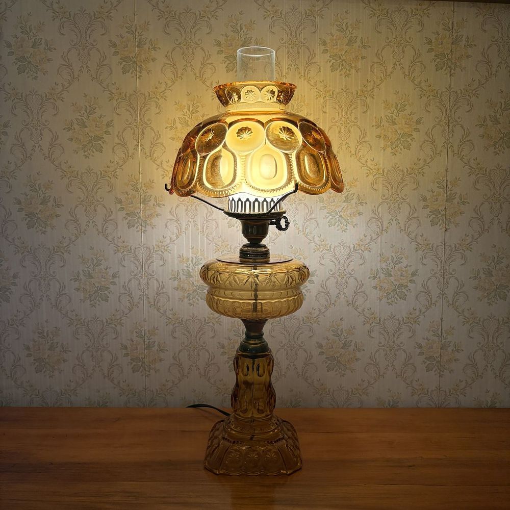 Lot 320: Amber Pressed Glass Moon and Star Pattern Electric Table Lamp