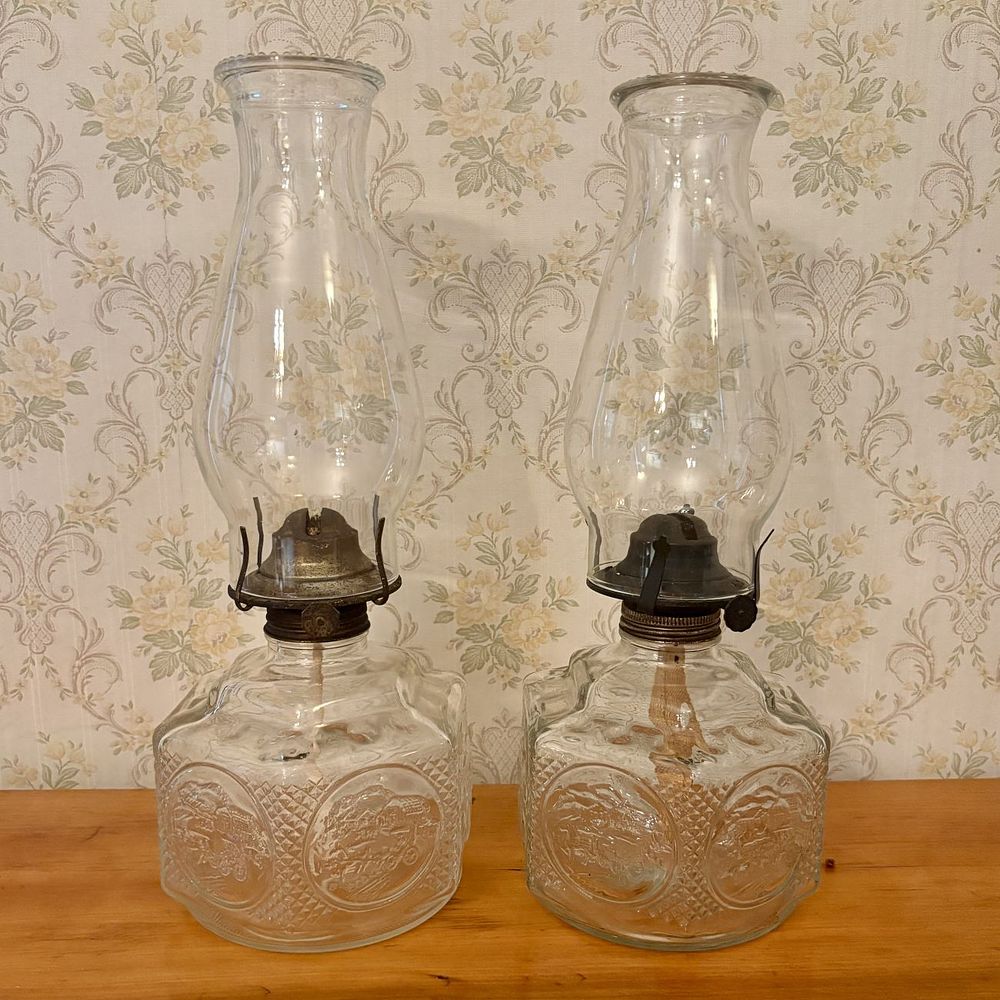 Lot 328: Pair of Clear Pressed Glass Table Oil Lamps with Stagecoach Motif