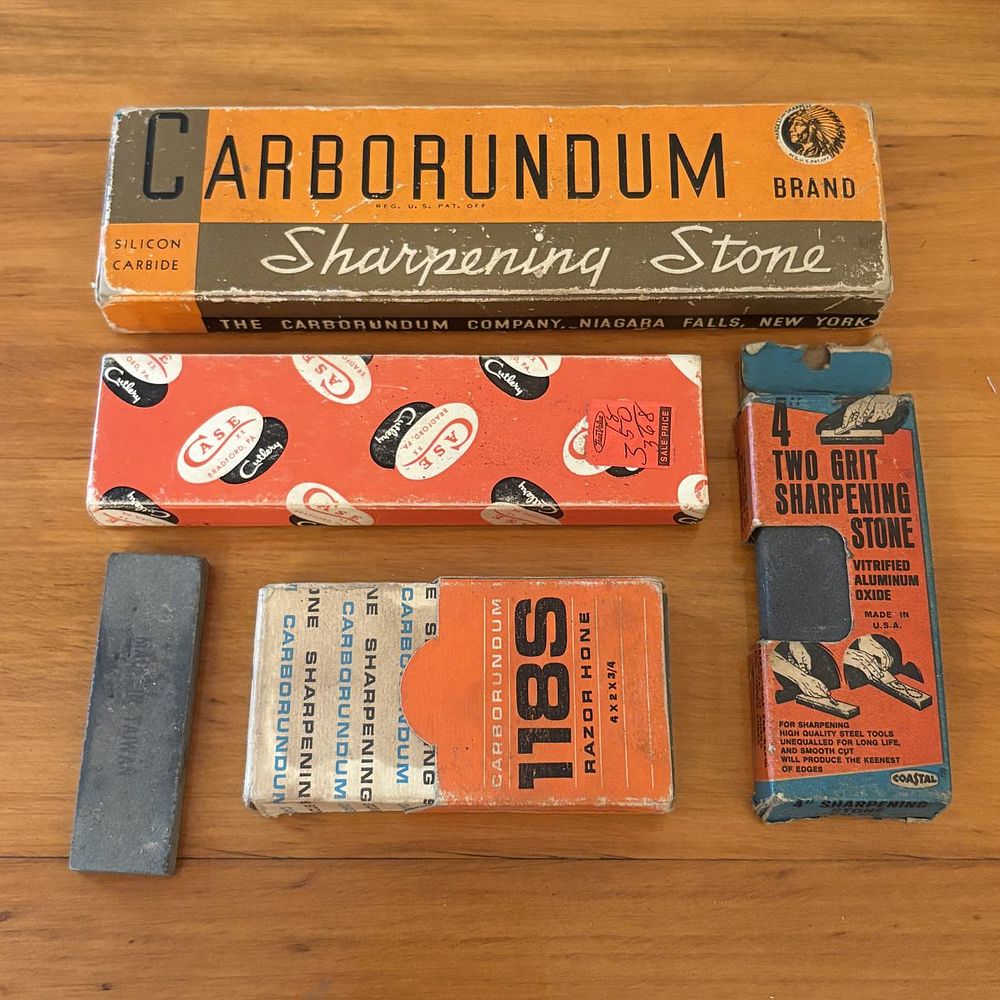 Lot 353: A Collection of Vintage Sharpening Stones and Razor Hones Including Carborundum and Case Examples