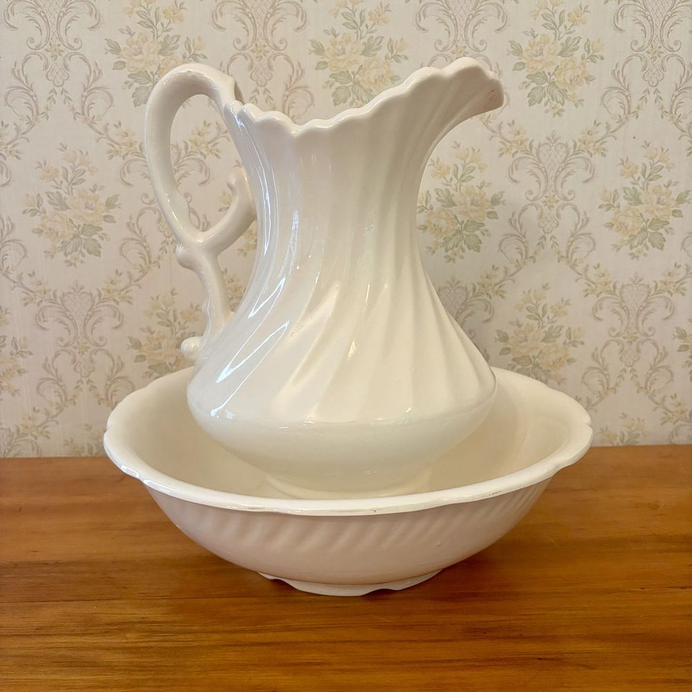 Lot 355: Two Piece White Earthenware Spiral Molded Wash Pitcher and Basin Set