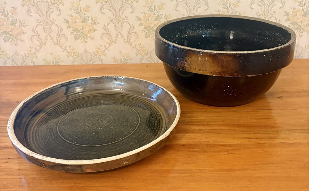 Lot 359: A Pair of American Albany Slip Glazed Stoneware Mixing Bowl and Underplate