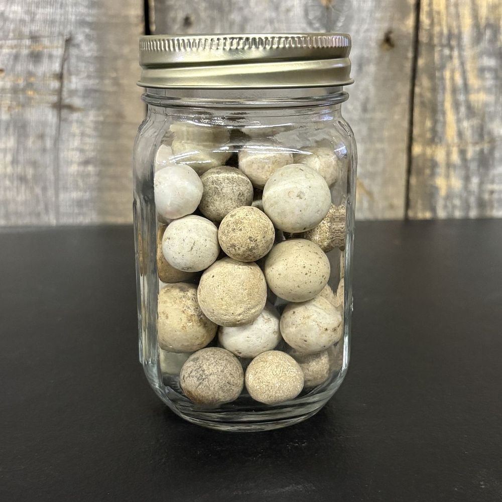 Lot 435: A Collection of Antique Hand-Rolled Clay Marbles in a Glass Jar