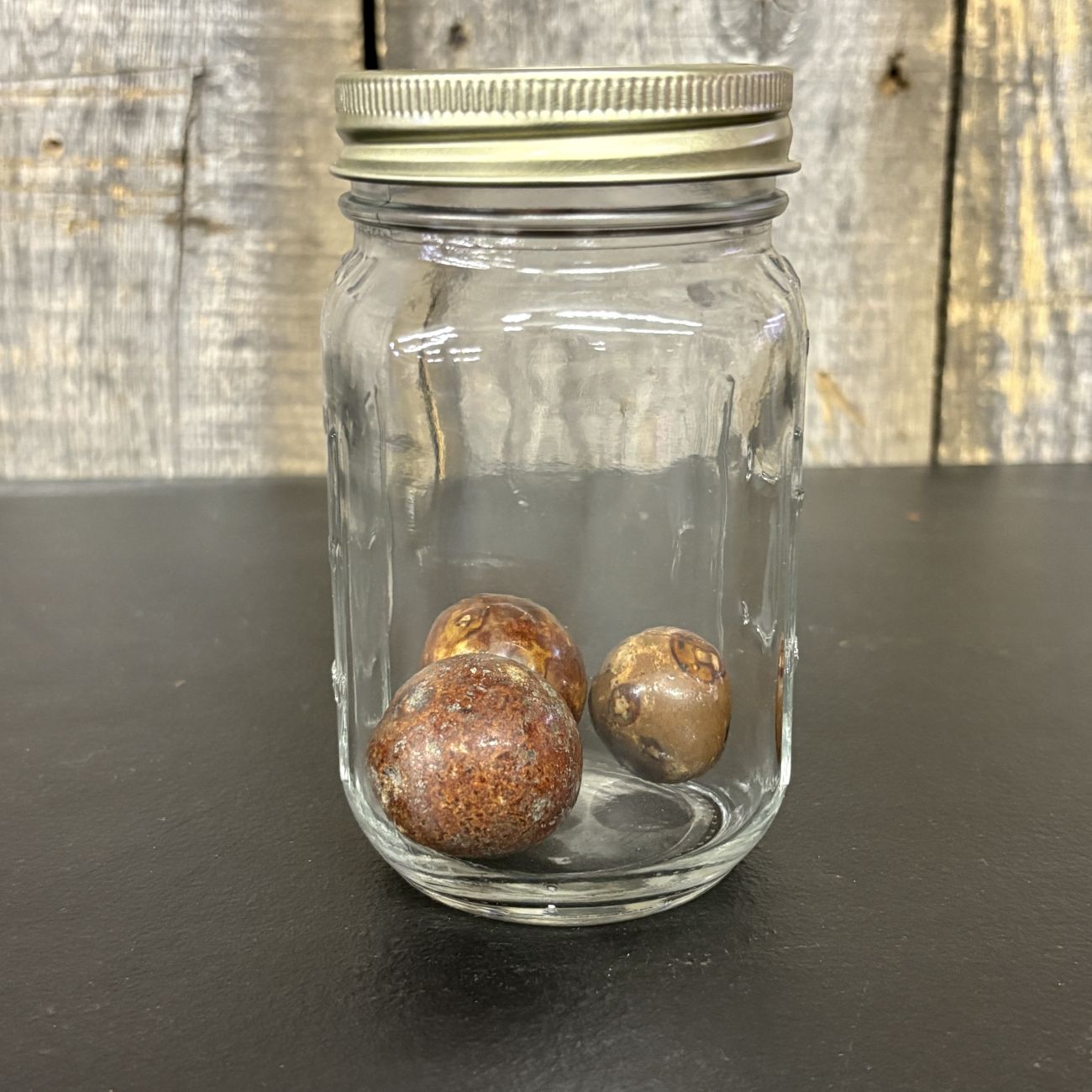 Three Antique Glazed Clay Marbles