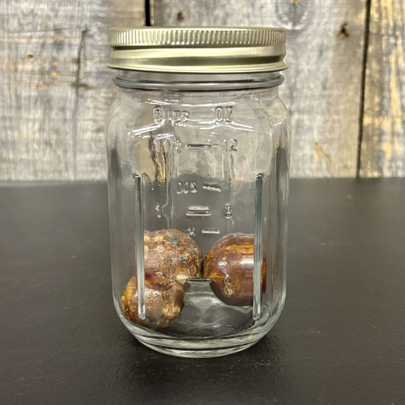 Three Antique Glazed Clay Marbles