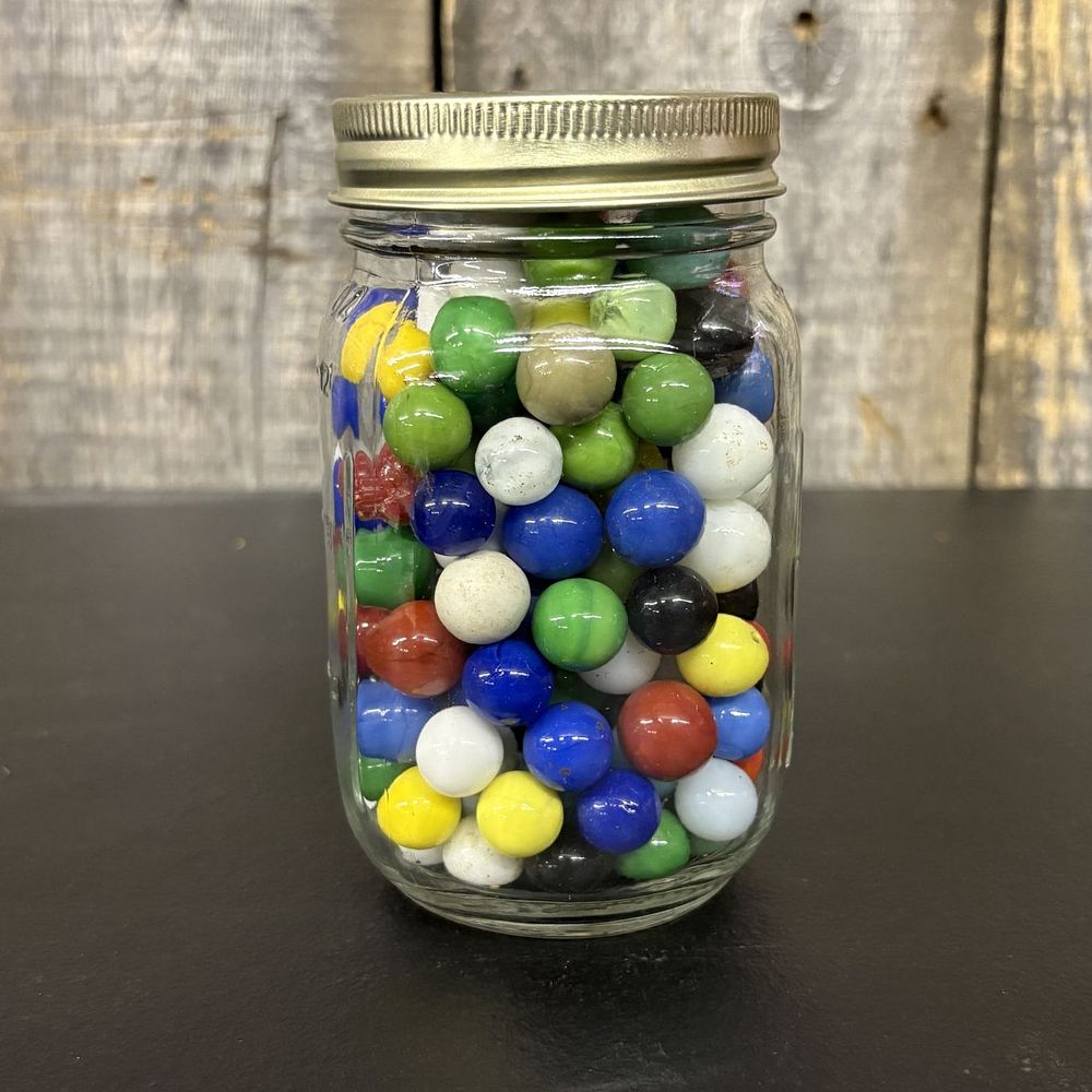 Lot 445: A Collection of Assorted Machine-Made Opaque Glass Marbles in a Glass Mason Jar