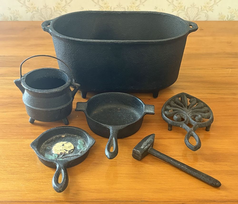 Lot 471: A Collection of Miniature Cast Iron Cookware and Kitchen Items