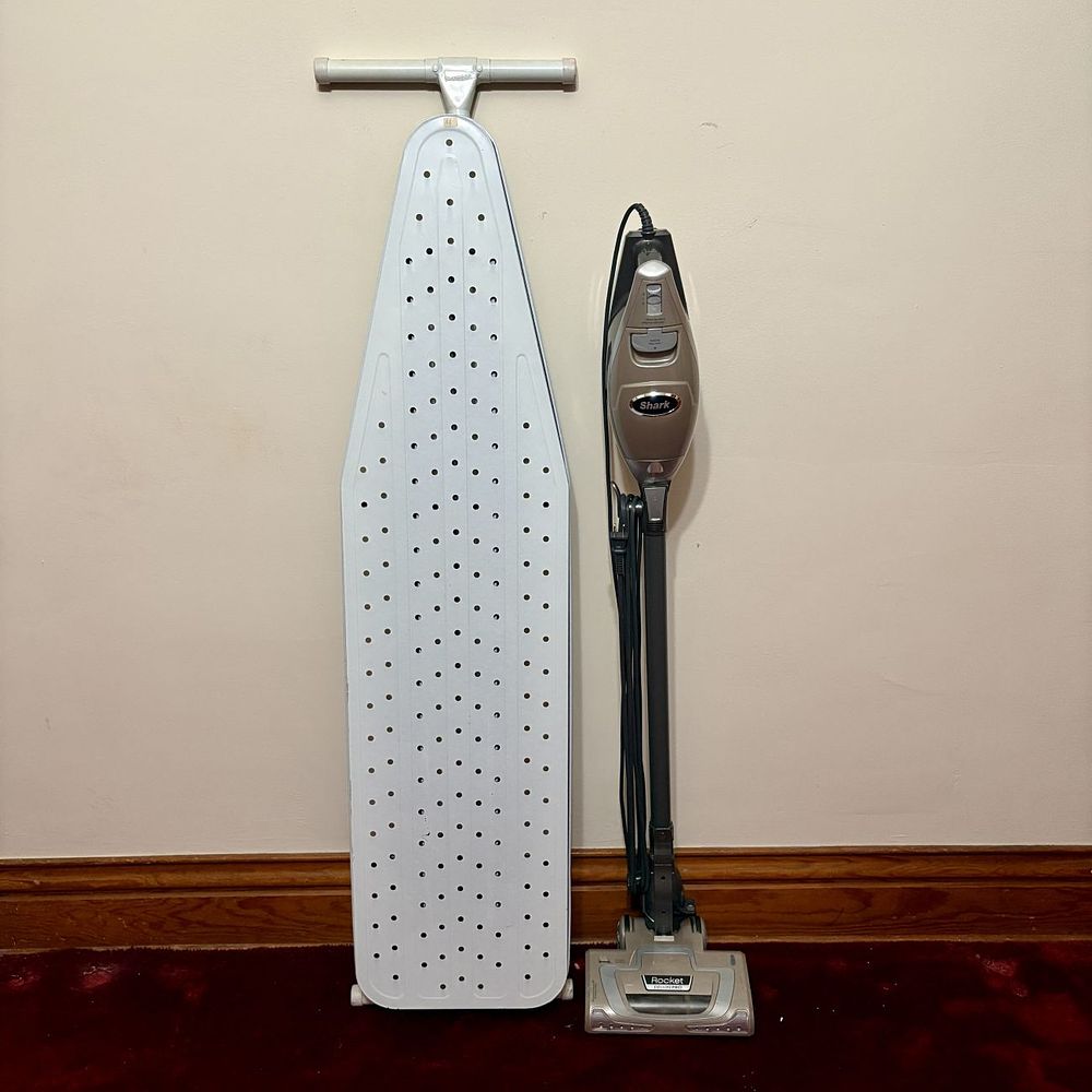 Lot 501: Shark Rocket Deluxe Pro Corded Stick Vacuum and Seymour T-Leg Ironing Board