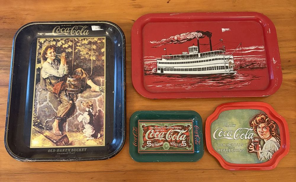 Lot 528: A Collection of Four Coca-Cola Lithographed Tin Advertising Serving and Tip Trays