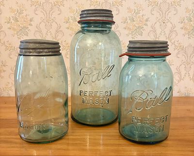 Three Ball Aquamarine Glass Mason Jars with Zinc Lids. A trio of antique American-made 