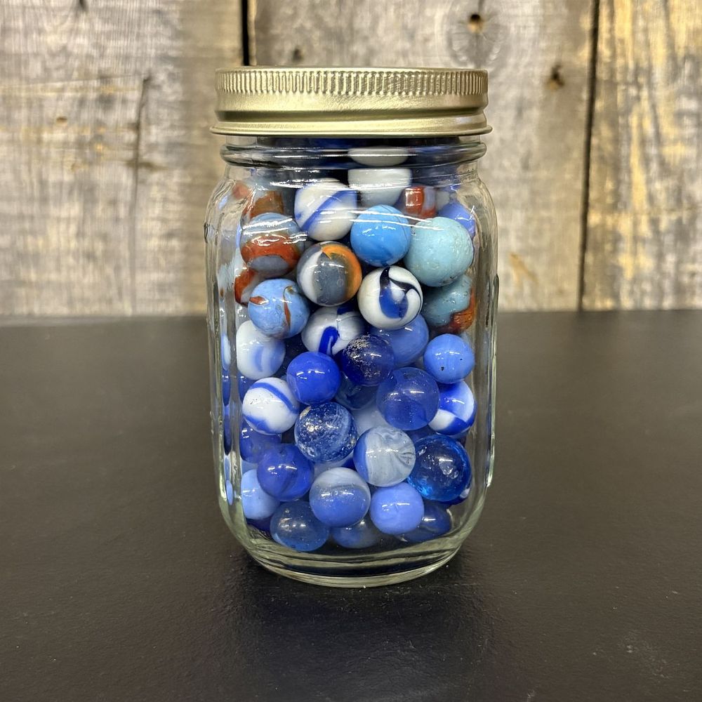 Lot 659: A Collection of Assorted Vintage Glass Marbles in a Graduated Glass Jar