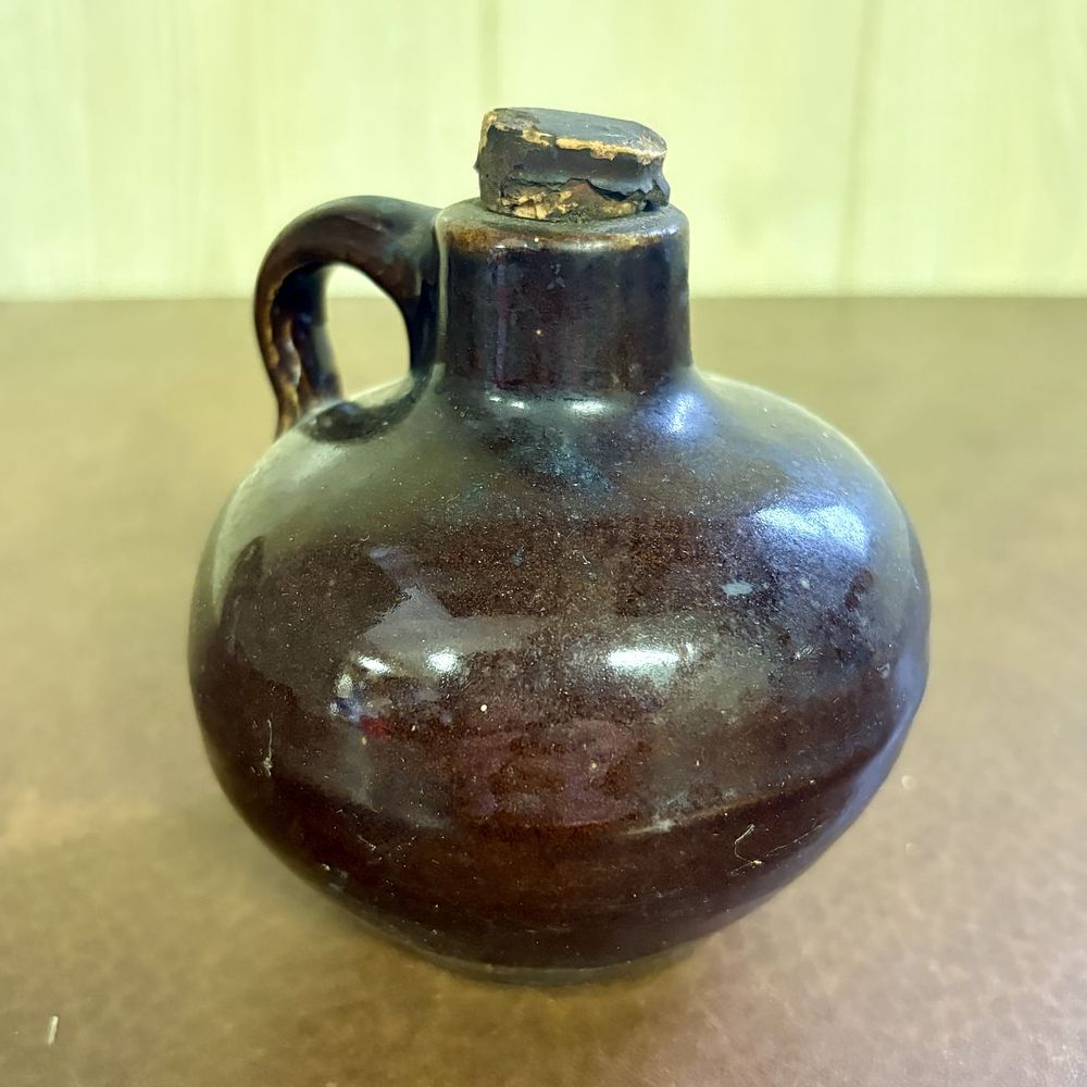 Lot 676: Miniature Stoneware Whiskey Jug in Dark Brown Albany Slip Glaze