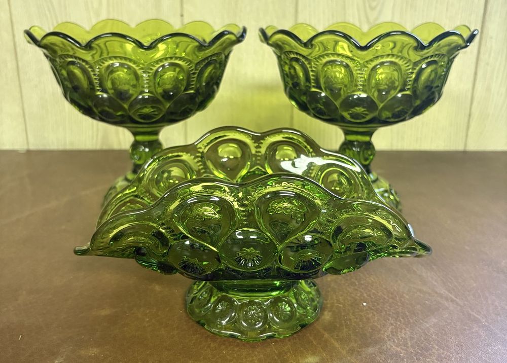 Lot 685: Three Piece Set of Moon and Star Pattern Olive Green Pressed Glass Pedestal Compotes and Bowl
