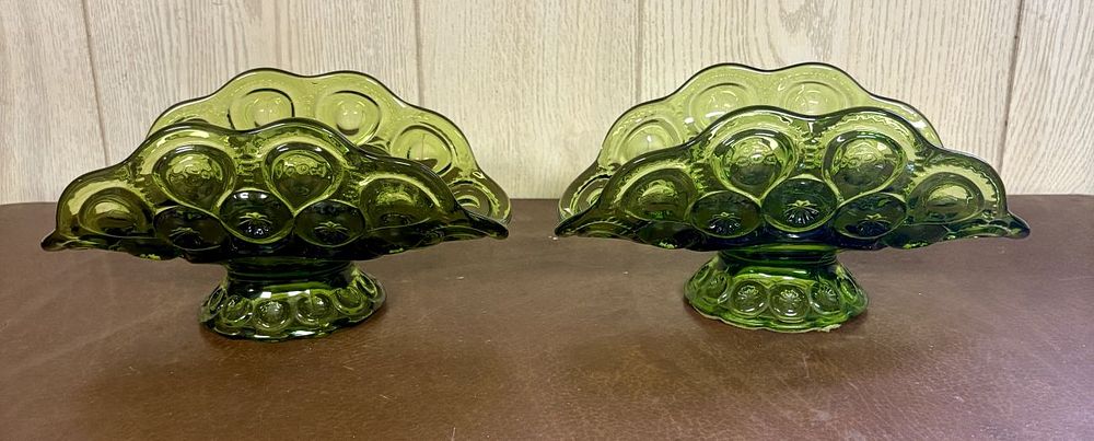 Lot 687: A Pair of Olive Green Pressed Glass Moon and Star Pattern Footed Banana Bowls