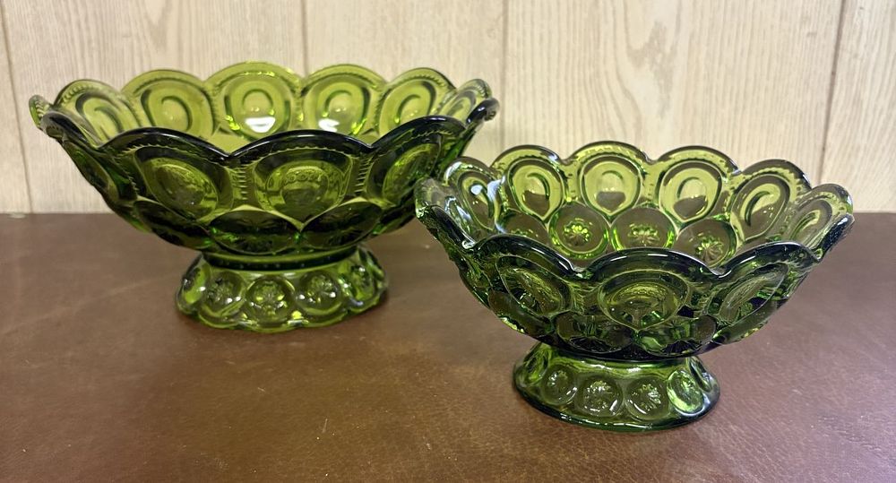 Lot 688: A Pair of Olive Green Pressed Glass Moon and Star Pattern Footed Bowls