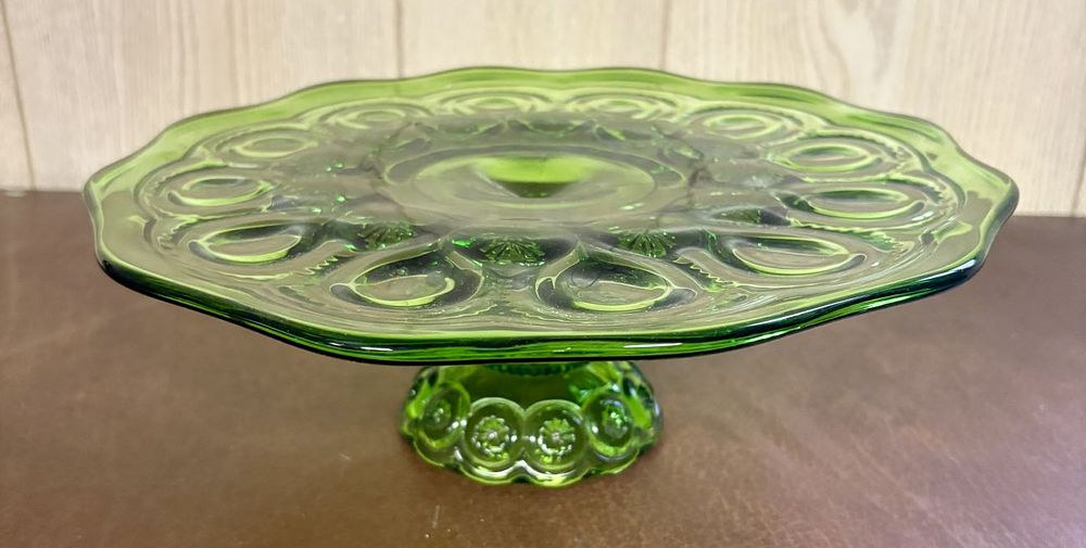 Lot 689: Pressed Emerald Green Glass Pedestal Cake Stand in Moon and Star Pattern