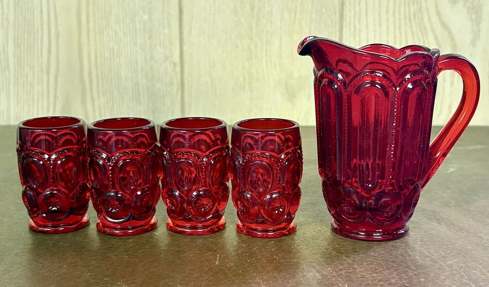 Lot 694: A Set of Moon and Star Pattern Ruby Red Pressed Glass Pitcher and Individual Tumblers