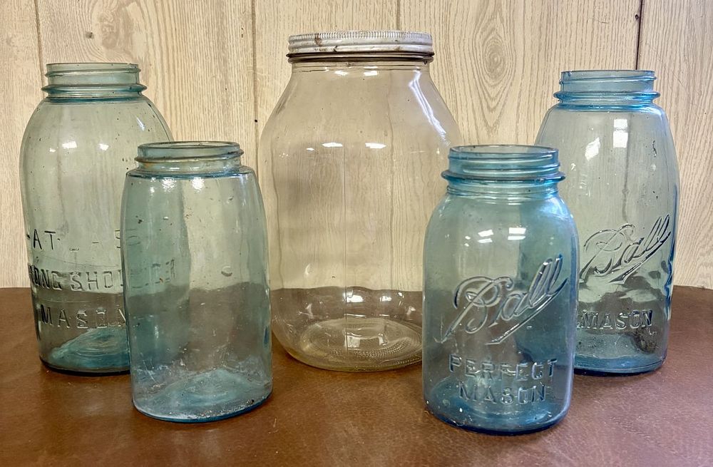 Lot 695: An Assortment of Vintage Blue Glass Ball and Atlas Mason Jars and a Large Clear Glass Jar