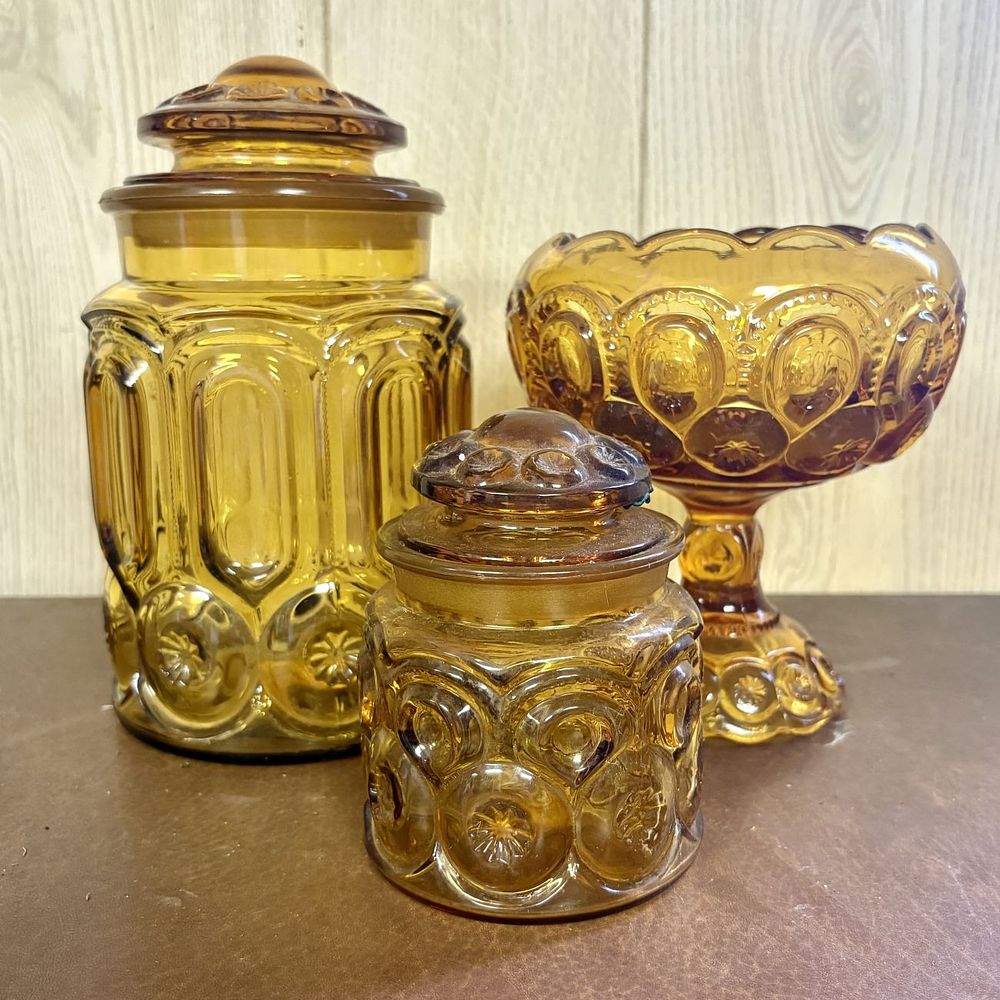 Lot 699: Three Pieces of Amber Moon and Star Pattern Pressed Glass
