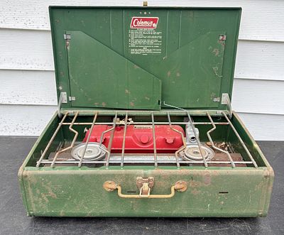 Coleman Two-Burner Liquid Fuel Camp Stove. An American portable two-burner liquid fuel camp 