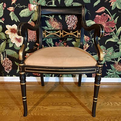 Regency Style Ebonized and Gilded Open Armchair. A Regency style open armchair featuring an 