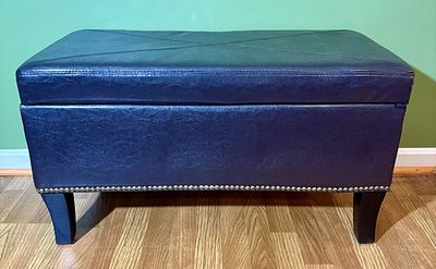 Navy Blue Faux Leather Storage Ottoman Bench with Nailhead Trim. A rectangular storage ottoman 