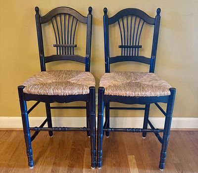 A Pair of Black Painted Wood Counter Height Stools with Rush Seats. A pair of counter-height 