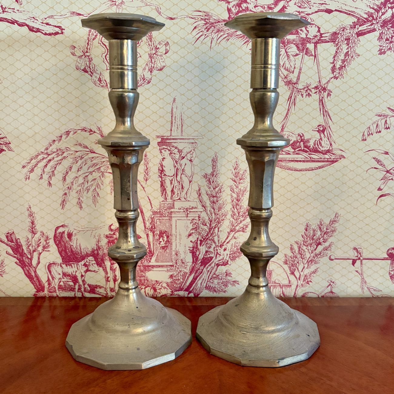 A Pair of Chinese Brass Candlesticks in the Georgian Revival Style