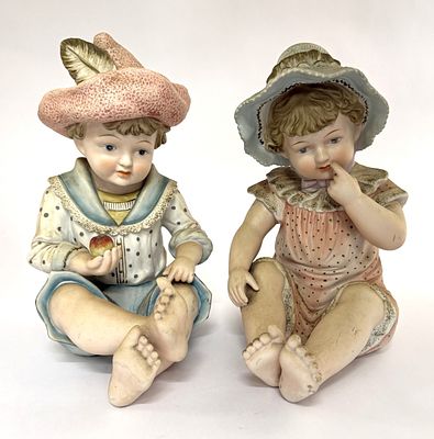 Porcelain Piano Babies Girl & Boy. Item/Description: Pair of bisque porcelain "piano baby" 