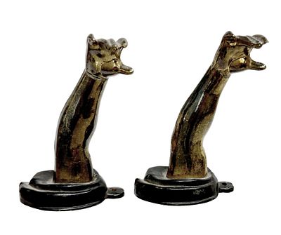 Petites Choses Gilt & Ebonized Figural Arm Hooks. Item/Description: Distinctive pair of 