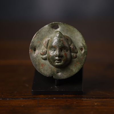 Rare Roman Bronze Bed Sconce of Eros, High Empire (1st - 2nd Century AD). 6 x 6 x 1.7 cm, bronze 