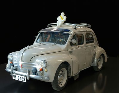 Renault 4CV with Michelin advertising figure. Classic Renault 4CV, closed body in gray with 