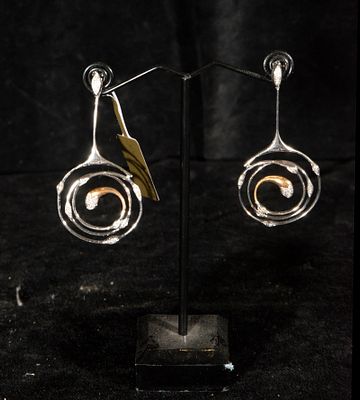 Long earrings in two-tone gold decorated with brilliant-cut diamonds. Estimated total weight 