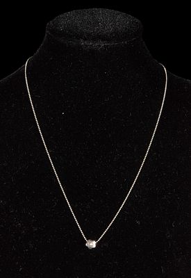 18k white gold flower design pendant with small brilliant-cut diamond. 18 carats