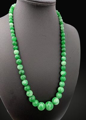 Vintage necklace of natural emerald green jade with spherical beads and silver clasp. Natural 