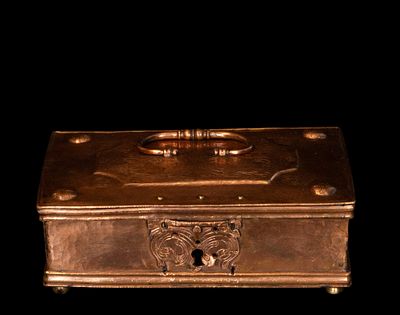 Copper cash box. German School. 17th century. Embossed and engraved copper. Measures 8 x 24 x 15 