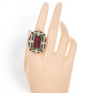 Ring with central ruby, emeralds, onyx and diamonds. A geometric band ring crafted in silver 